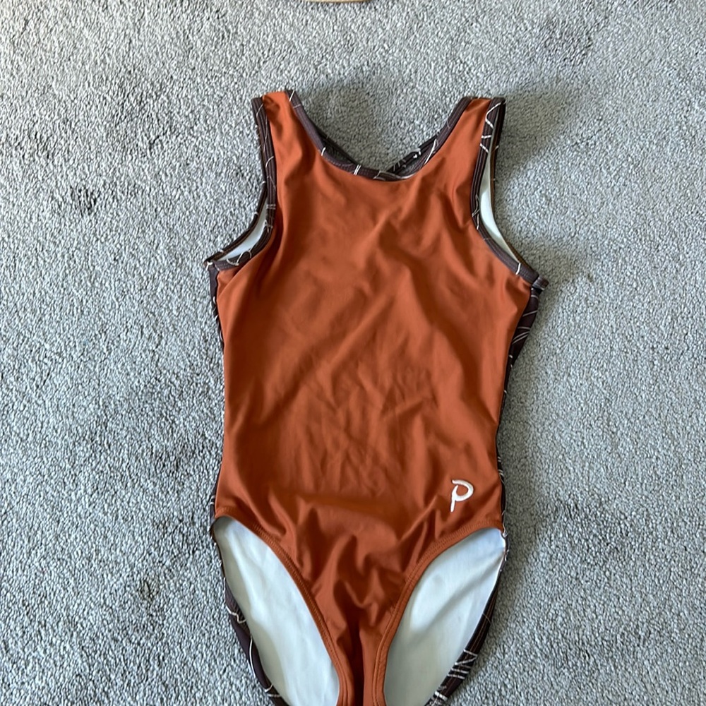 Plum gymnastics leotards